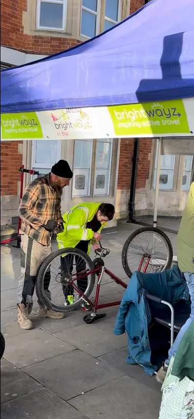 Bike mechanic fixing bike. bike on stand.